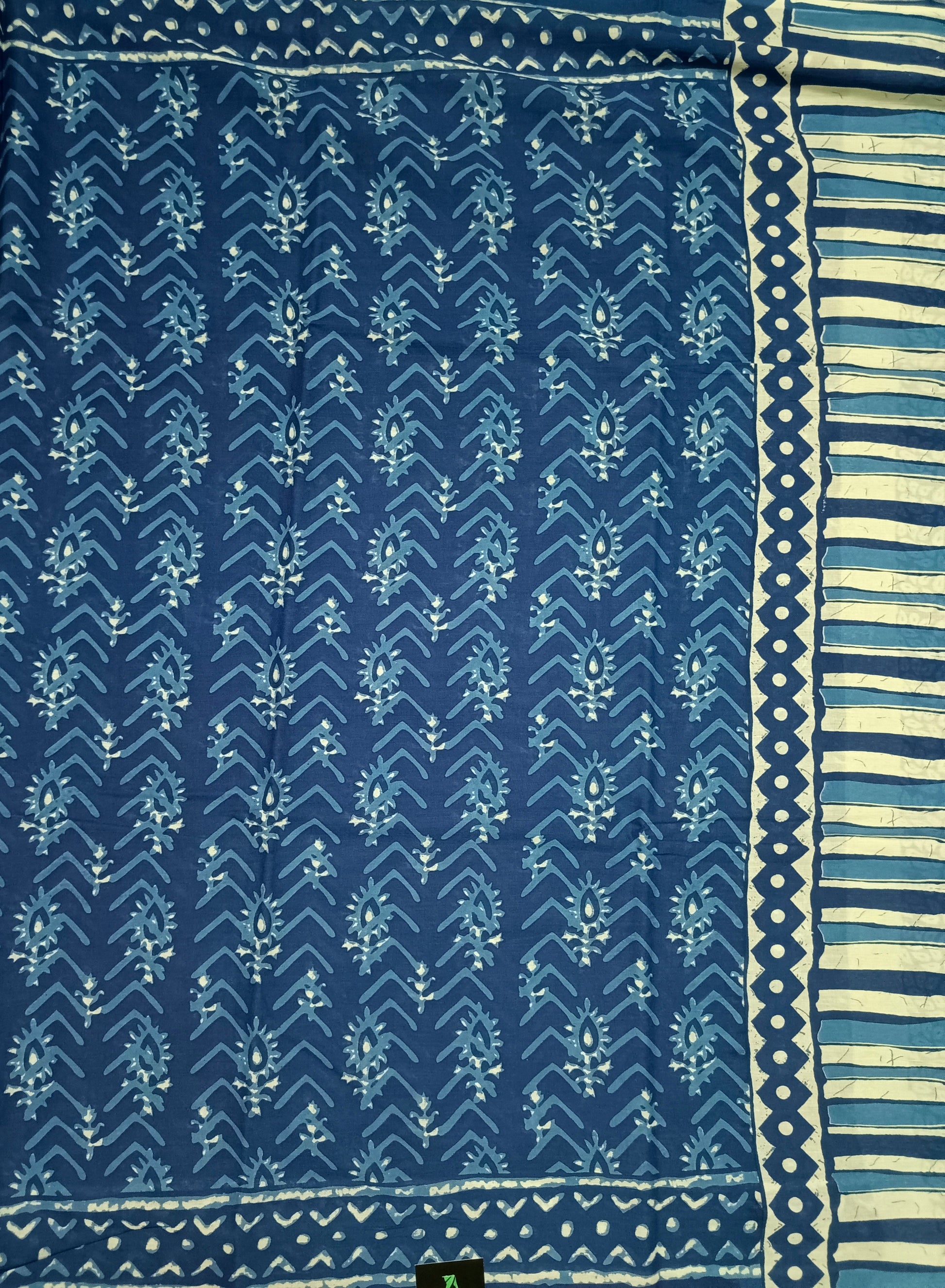 Blue patterned fabric with white border